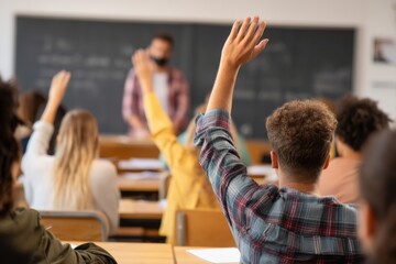 A student attentively raises their hand during an exam, seeking clarification. The teacher responds positively, fostering a supportive learning environment in a classroom filled with students