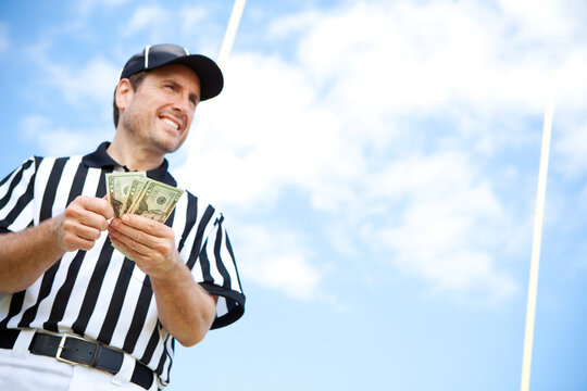 Referee: Ref With Handful of Cash