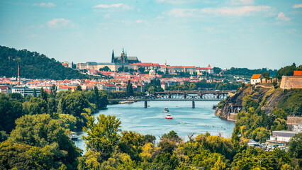 This panoramic view showcases the beauty of Prague, featuring the iconic Prague Castle and the...