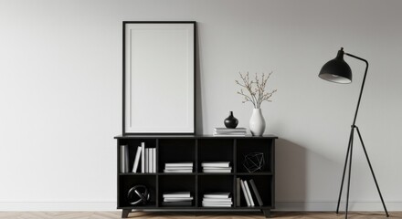 Modern Minimalist Home Decor: Stylish black bookcase with books, vase, and lamp against a minimalist white wall.  A large blank frame provides space for personalized artwork.