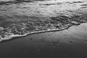 waves on the beach blacn and white