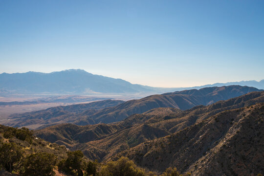 Scenic view from Keys View at Joshua Tree National Park across Little San Bernadino Mountains to Mount San Jacinto, San Andreas Fault and Coachella Valley, California, USA against blue sky