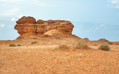 Rocky formation in desert landscape at Hegra, Saudi Arabia