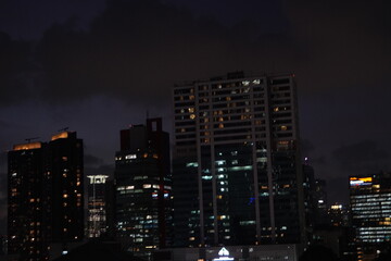Manila Skyline at Night: Illuminated Buildings Against a Dark Sky