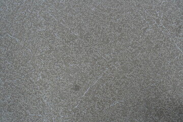 Textured gray surface with subtle white veining, creating a stone-like appearance