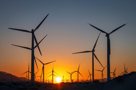 Scenic view of Palm Springs Windmills at Coachella Valley, California, USA at sunset against blue sky