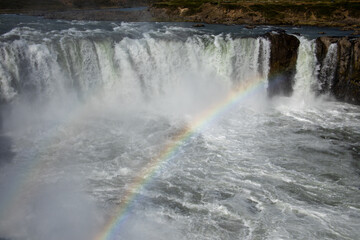 Obraz premium Rainbow in mist over Godafoss Waterfall