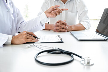 Professor Doctor consulting with patient discussing something and recommend treatment methods,...