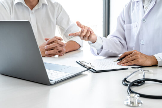 Professor Doctor consulting with patient discussing something and recommend treatment methods, Presenting results on report, Medicine and health care concept