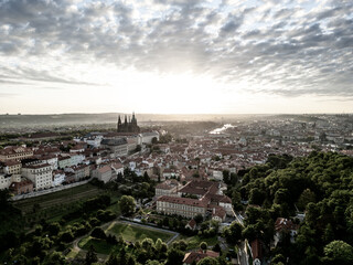 Soft morning light bathes Prague Castle and the surrounding cityscape in golden hues. Serenity...