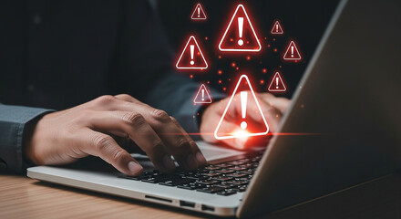 Cyber security threat alert on laptop computer with warning signs for virus malware and data breach risk
