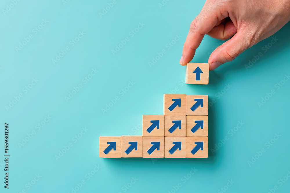 Poster ascending heights a hand places a block with an upward arrow on a stack symbolizing growth, progress