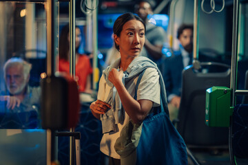Young woman feeling unsafe riding public transport at night
