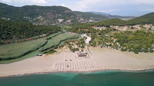 Aerial view of forest, river, mountain with boats, Turkey.