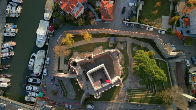 Aerial view of Anadolu Hisari fort and boats at sunset, Turkey.