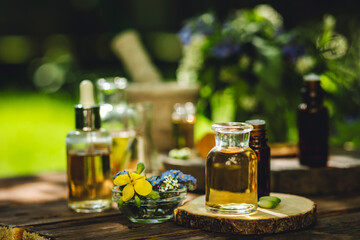 Natural ingredients in cosmetic and medicine. Assortment of organic essential oils in glass...