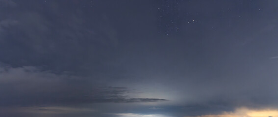 Beautiful night sky background, with long exposure clouds, starry sky.