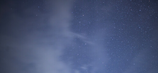 Beautiful night sky background, with long exposure clouds, starry sky





