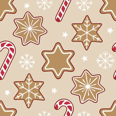 Obraz premium Festive seamless Christmas pattern with gingerbread cookie stars and candy canes, a charming winter design. Christmas pattern includes delightful gingerbread cookie shapes,