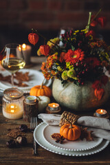 Elegant atmospheric beautiful dinner table setting for thanksgiving or wedding celebration, fall...