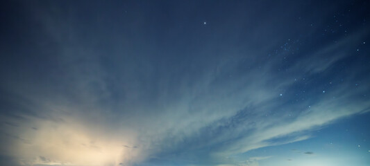 Beautiful night sky background, with long exposure clouds, starry sky.