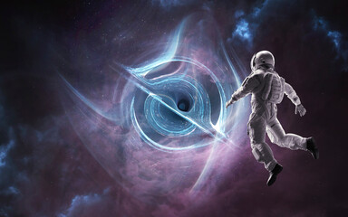 Astronaut Reaching Toward Luminous Wormhole in Deep Space &mdash; A lone astronaut in front of a swirling vortex of light and shadow, framed by a dark nebula and distant stars