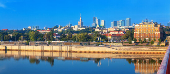 Naklejka premium Cityscape, panorama, banner - view of the district of Srodmiescie with the Old Town in the center Warsaw, view from the Vistula River, Poland