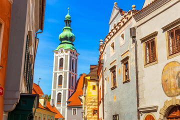Summer cityscape - view of former Church of Saint Judoc on Latran street in the historical center of Cesky Krumlov, Czech Republic