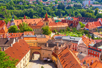 Summer cityscape - top view of the courtyard of Cesky Krumlov Castle and historic district Latran of Cesky Krumlov, Czech Republic