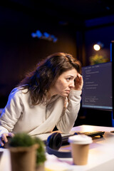 Tired software developer hurting from too much stress accumulated while doing quality assurance....