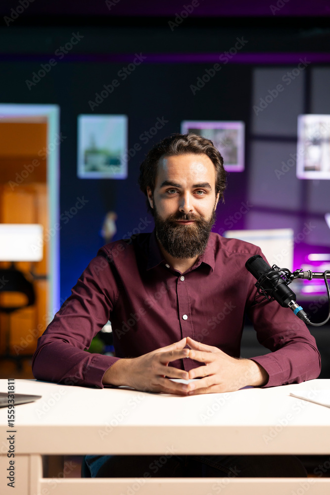 Poster portrait of influencer in home studio using professional microphone to record live broadcast for onl