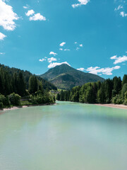 Scenic Lake in Moena, Trentino with Mountain and Forest Landscape