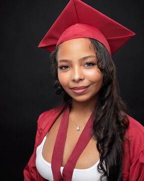 Young African-American Teen Woman Graduation Cap and Gown