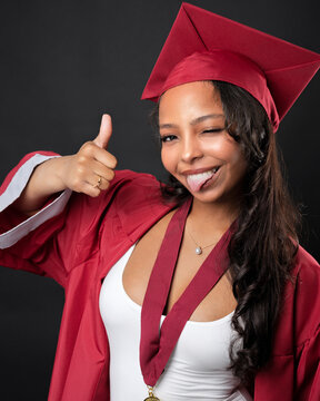 Young African-American Teen Woman Graduation Cap and Gown