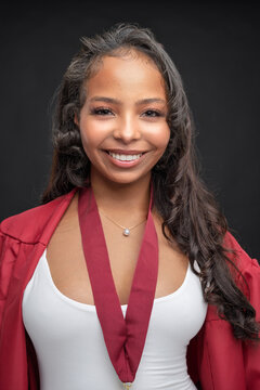 Young African-American Teen Woman Graduation Cap and Gown