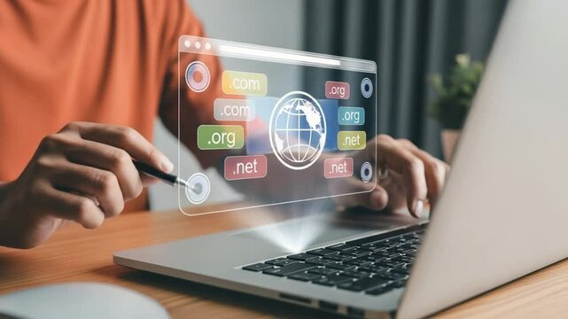 Person using laptop with domain name interface overlay showing .com .org and .net options visible