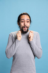 Happy enthusiastic person receiving good news and being excited about something, cheering and...