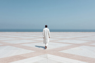 urban sprawl in pakistan at high noon featuring solitary figure at top of frame