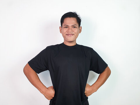 Confident Young Asian Man Smiling with Hands on Hips Against White Background - Powered by Adobe