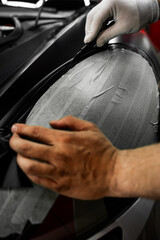 Wrapping vinyl requires perfect tension and accurate blade work for high-end detailing. Vinyl film...