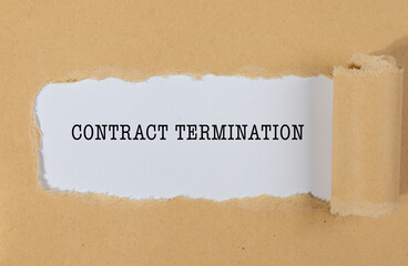 The Text “CONTRACT TERMINATION” Appearing Behind Torn Brown Paper – Legal & HR Concept
