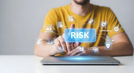 A person's finger hovers over a glowing 'RISK' button within a complex holographic business analysis system.
