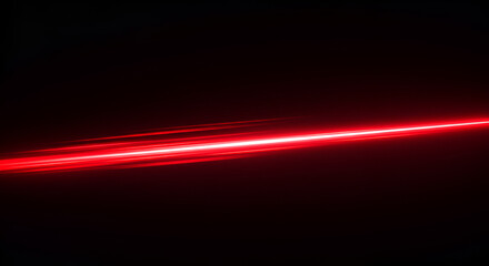 Vibrant red laser beam against a stark black backdrop, creating dynamic contrast