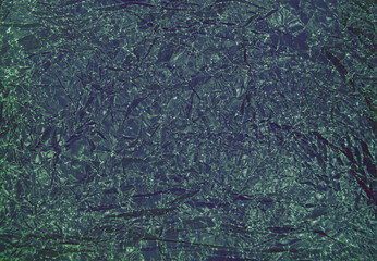 Close-up fragment of dark crumpled paper texture as a backdrop composition. Crumpled dark paper texture background
