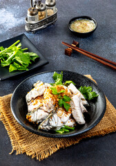 steamed sea bass sliced fish with dipping sauce and vegetable