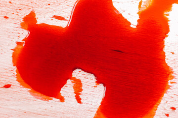 Blood Dripping and Splattering on Wood Surface.Abstract Red Liquid Spilled.