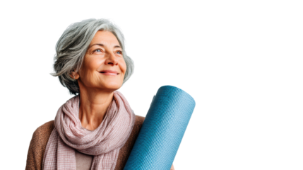 Confident senior woman holding yoga mat, smiling, wearing scarf, wellness concept, isolated on white background.