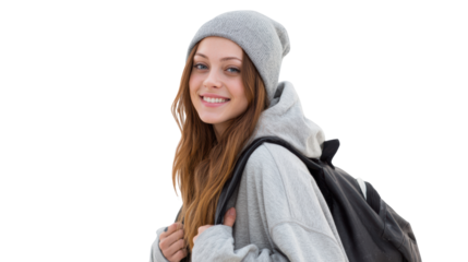 Young woman in a gray outfit with a backpack, smiling and posing against a white isolated background.