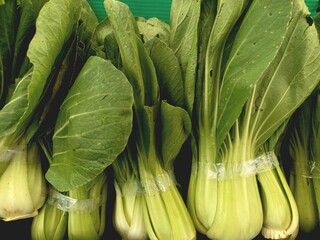 Fresh mustard greens sold on the market. Mustard greens contain many nutrients that are good for...