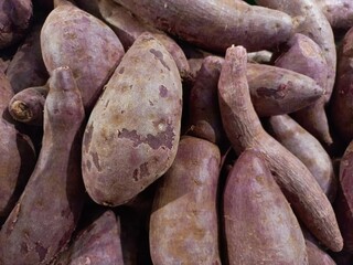 Fresh purple sweet potato sold in the market. Purple sweet potato contains many nutrients that are good for the body.